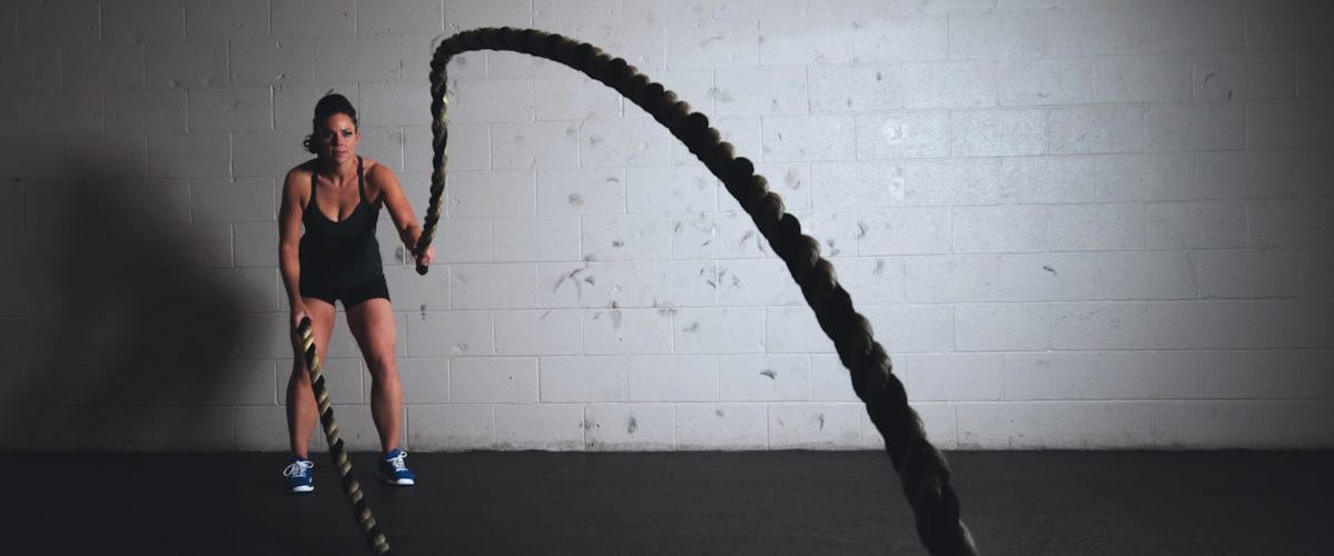 woman holding brown ropes