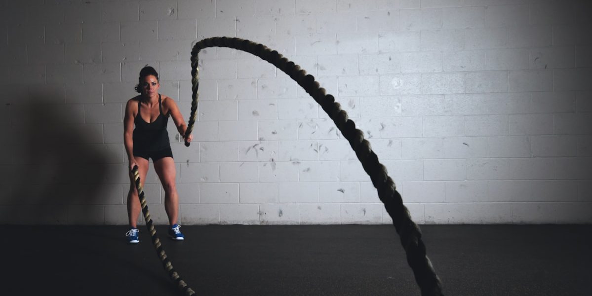 woman holding brown ropes