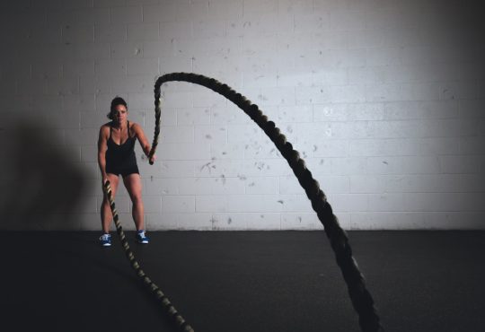 woman holding brown ropes